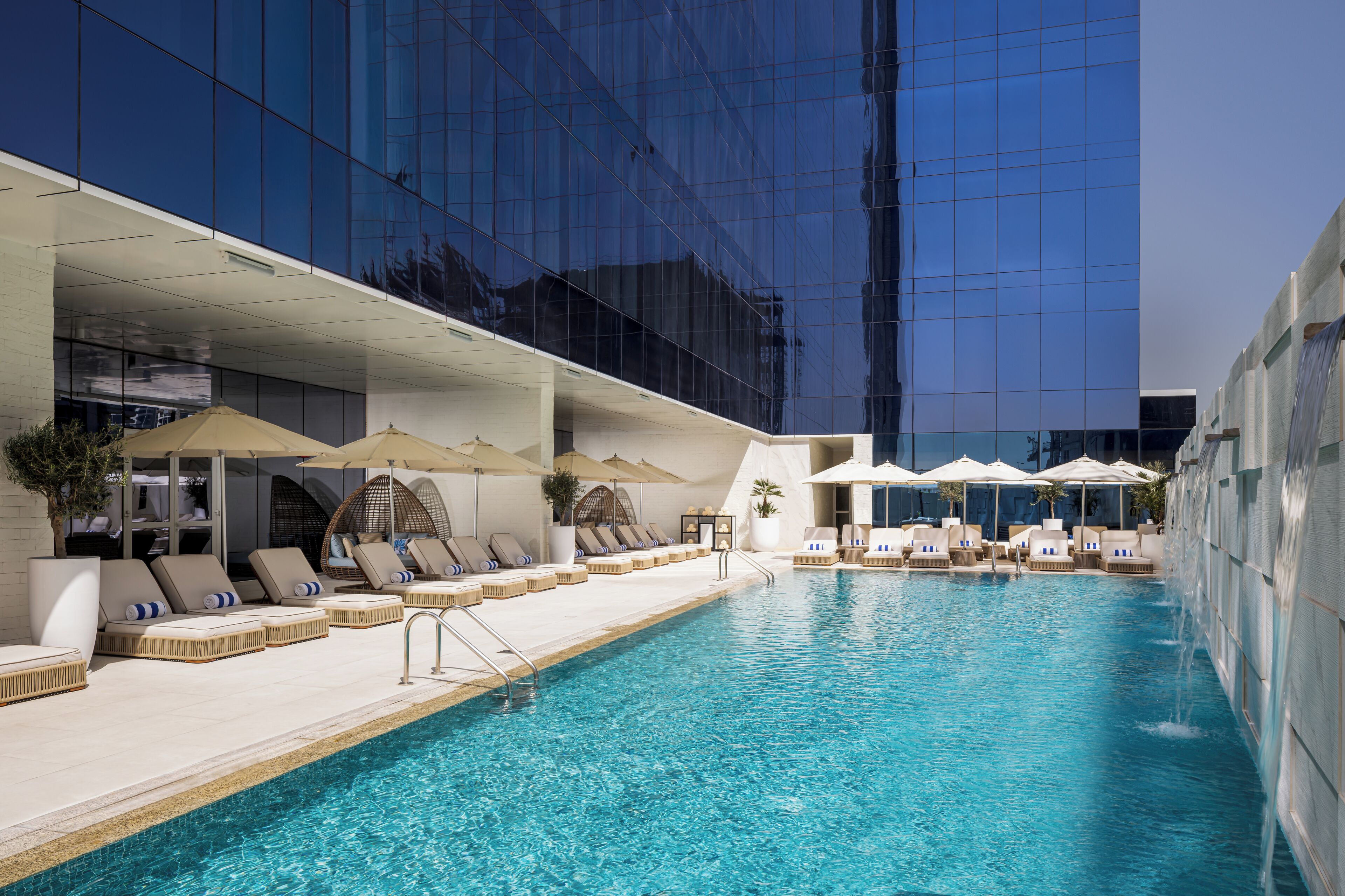Outdoor pool, open 7:00 AM to 9:00 PM, pool umbrellas, sun loungers
