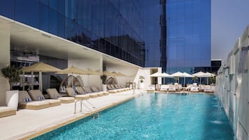 Outdoor pool, open 7:00 AM to 9:00 PM, pool umbrellas, sun loungers