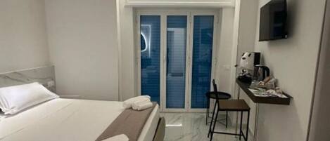 1 غرفة نوم ومكواة/لوح كي وواي فاي وملاءات أسرّة