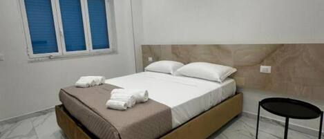 1 غرفة نوم ومكواة/لوح كي وواي فاي وملاءات أسرّة