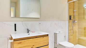 Superior Studio | Bathroom | Shower, hair dryer, towels, soap