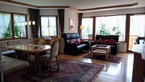 Apartment, 2 Bedrooms, Balcony | Living room | Flat-screen TV