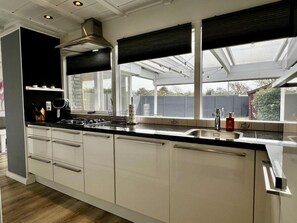House | Private kitchen | High chair - Beautiful Bungalow in North Holland (Sint Maartensvlotbrug)