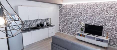 Apartment, Balcony | Living area | 46-inch Smart TV with cable channels, heated floors