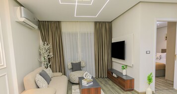 Studio Comfort, balkon | Area keluarga | TV layar datar dan perapian