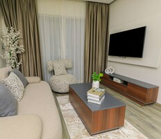 Studio Comfort, balkon | Area keluarga | TV layar datar dan perapian