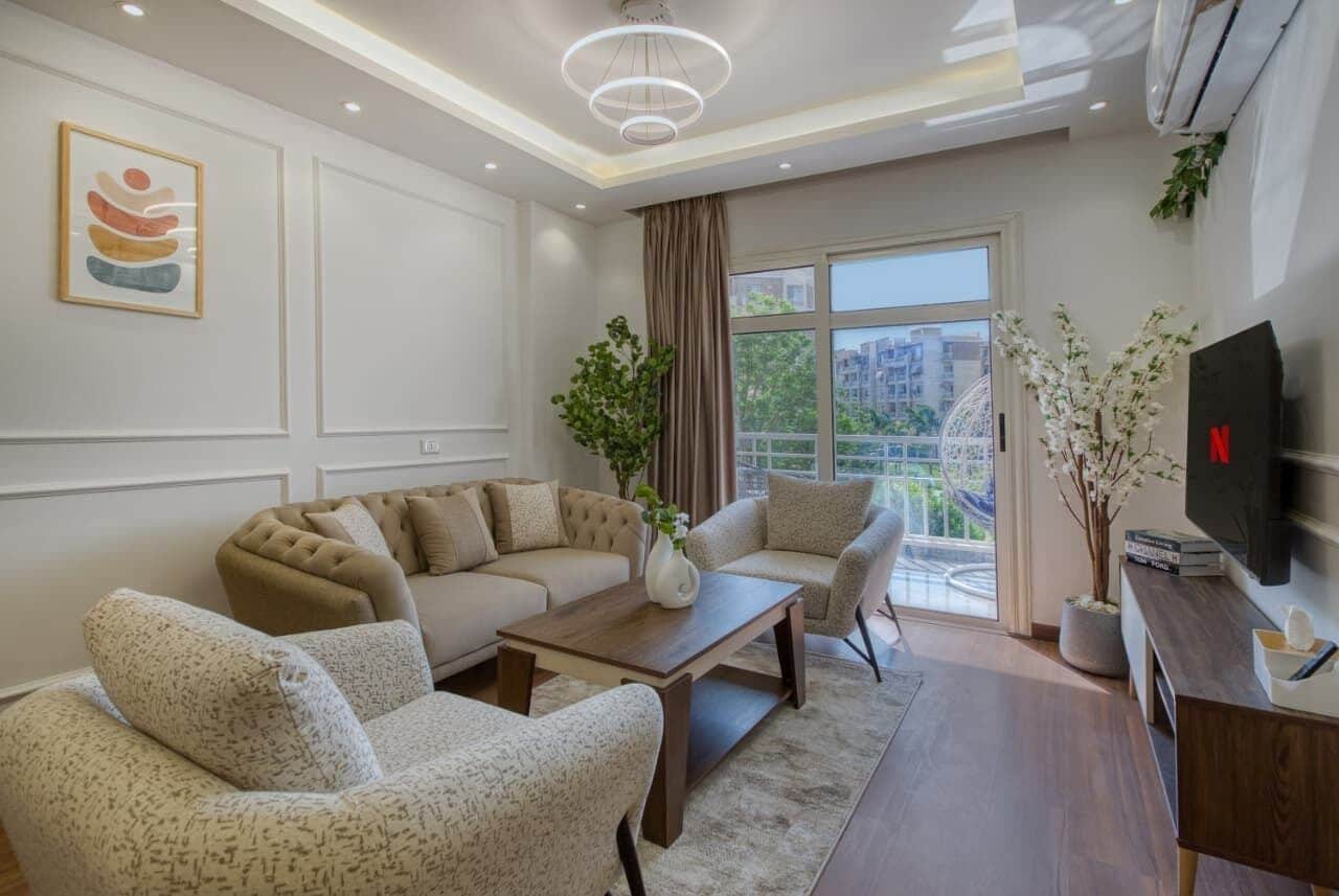 Deluxe Apartment, Garden View | Living area | Fireplace