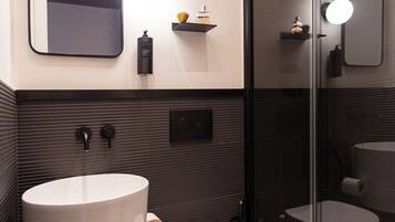 Shower, eco-friendly toiletries, hair dryer, slippers
