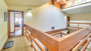 A wooden staircase with a view of a room below. - Pool + Hot Tub Access: Condo in Winter Park! (Winter Park)
