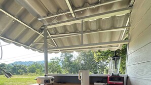 A covered outdoor kitchen area with a sink, countertop, and a blender. - 1BR Mountain View #2 - 1000mbps WiFi (Ko Pha-ngan)