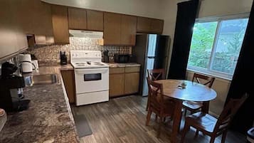 Apartment, 2 Bedrooms | Private kitchen | Fridge, oven, coffee/tea maker