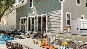 A house with a pool, outdoor seating, and a bar area. - 14BR Luxury Compound | Private Pool, Built-in spa (Savannah)
