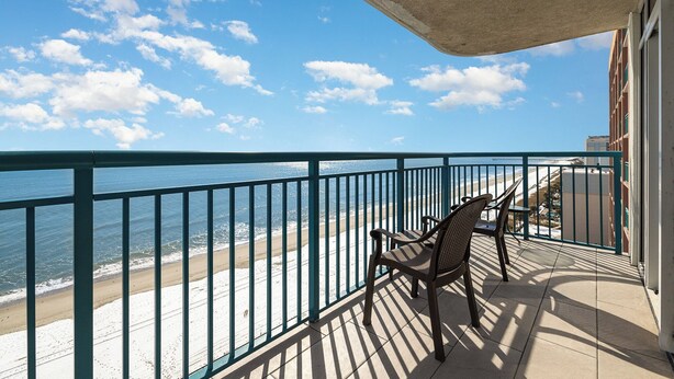 A balcony with a view of the beach and ocean. - Spectacular 3 BR 2 BA Ocean Front Condo (Myrtle Beach)