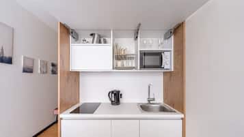 Fridge, microwave, stovetop, cookware/dishes/utensils