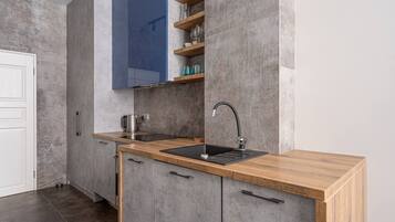 Fridge, stovetop, cookware/dishes/utensils, dining tables