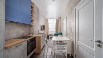 Fridge, stovetop, cookware/dishes/utensils, dining tables