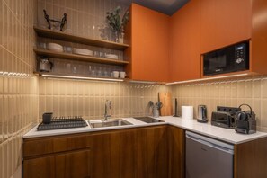 Fridge, microwave, stovetop, coffee/tea maker