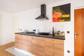 Fridge, stovetop, cookware/dishes/utensils, dining tables