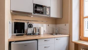 Fridge, microwave, stovetop, coffee/tea maker