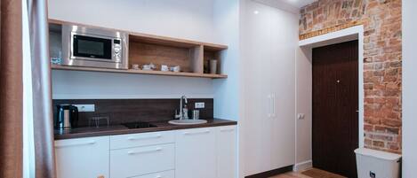 Fridge, microwave, stovetop, cookware/dishes/utensils