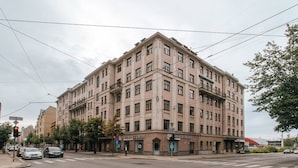 A multi-story building with a commercial ground floor, including a visible storefront with signage for 'SEFINANCE CREDIT'. - Hanzas residence near ArtNouveau quarter & OldTown (Riga)