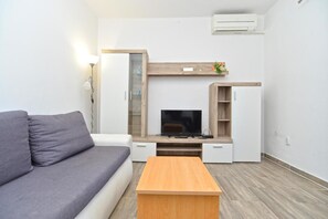 Apartamento, 1 quarto, para fumantes, terraço | Área de estar
