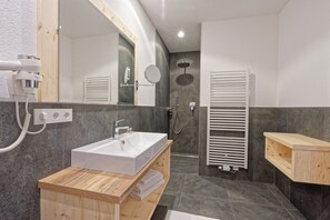 Shower, hair dryer, towels, toilet paper