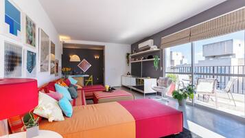 Apartment | Living area | 55-inch Smart TV with cable channels