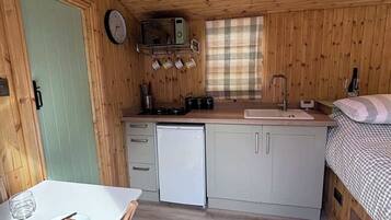 Fridge, microwave, stovetop, cookware/dishes/utensils