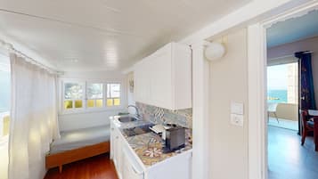 Studio, Sea View | Private kitchen | Fridge, microwave, stovetop, cookware/dishes/utensils
