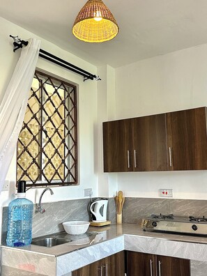 Fridge, microwave, electric kettle, cookware/dishes/utensils