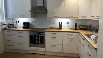 Apartment, 2 Bedrooms | Private kitchen | Full-size fridge, microwave, freezer