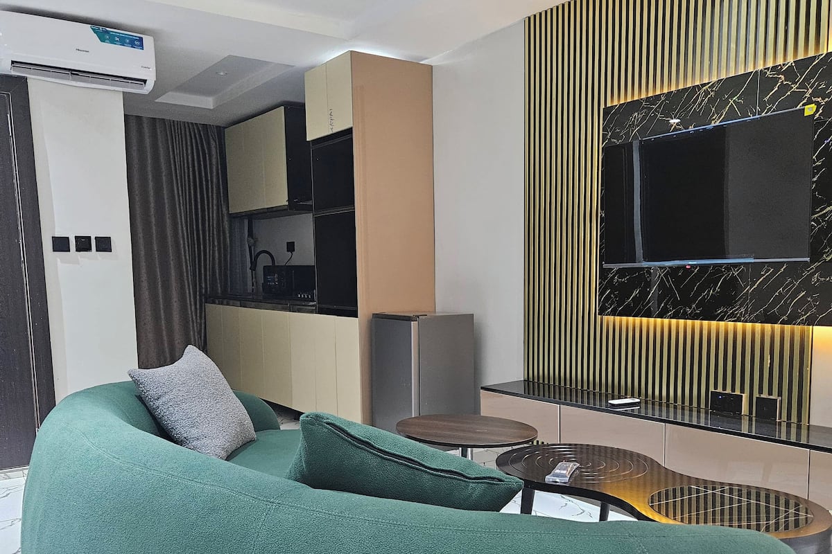 Suite Deluxe, 1 très grand lit, coin cuisine | Coin séjour