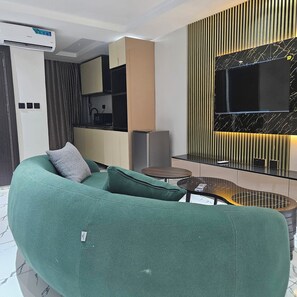 Deluxe Suite, 1 King Bed, Kitchenette | Living area | 42-inch LED TV with cable channels - Anibex Luxe (Abuja)