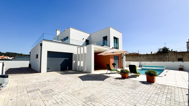A modern two-story house with a garage, a swimming pool, and outdoor seating. - Casa da Praceta - By SCH (Alfeizerão)