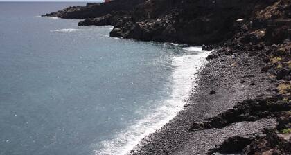 Quiet and relaxing cave with a deserted beach