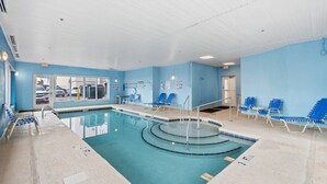 An indoor swimming pool with clear water, blue lounge chairs, and a no diving sign on the wall. - Oceanfront Views w/ 7 Beds, Pools, Lazy River, Gym (North Myrtle Beach)
