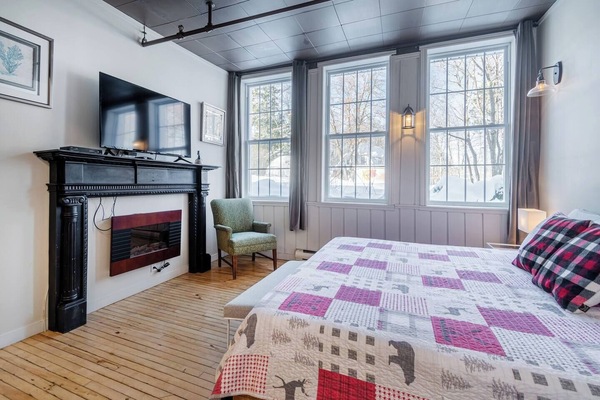 Queen bed and electric fireplace