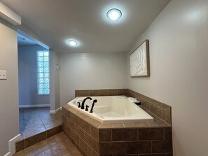 Shower, jetted bath, bidet, towels