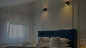 A bedroom with a large bed, a bedside table, and a nightstand. - Charming Holiday home with private pool,teniss field WiFi... Imotski,Croatia (Gornji Vinjani)