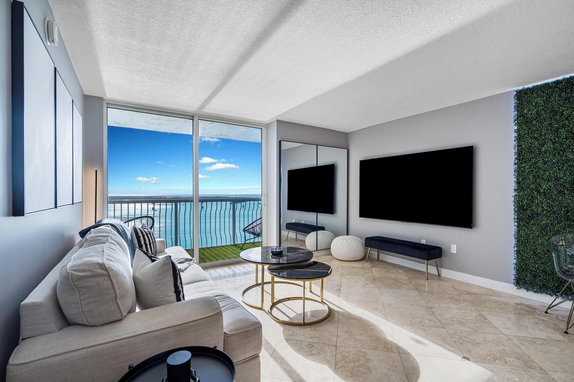 Design Condo, 3 Bedrooms, Balcony, Sea View | Living area | 50-inch plasma TV with cable channels