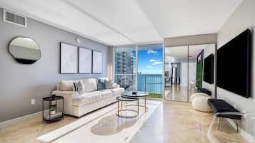 Design Condo, 3 Bedrooms, Balcony, Sea View | Living area | 50-inch plasma TV with cable channels