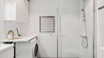 Shower, hair dryer, towels, soap