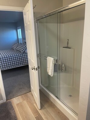 Shower, hair dryer, towels, soap