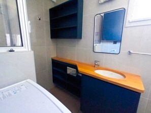 Shower, towels, soap, toilet paper