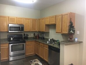 Fridge, microwave, oven, stovetop - Pool View 2 Bedroom/2 Bath Condo in Houston's Medical Center (Houston)