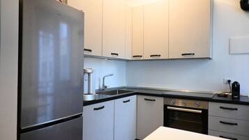 Fridge, oven, dishwasher, dining tables