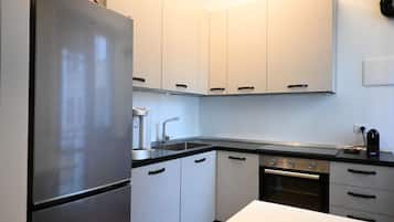 Fridge, oven, dishwasher, dining tables