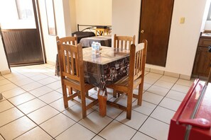 Enjoy meals in this dining area with a table and four chairs.