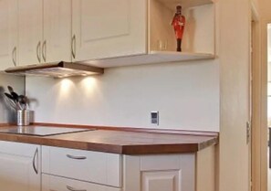 Enjoy cooking in this well-equipped kitchen with an oven and microwave.